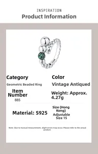 Macro detail of S925 sterling silver beaded ring with green gemstone sphere and size data