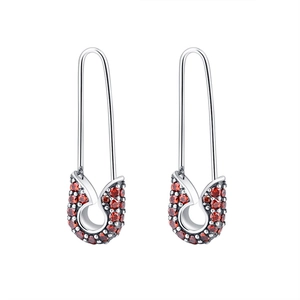 Sterling silver safety pin earrings with pave red crystal accents on a white background