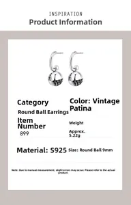 Detail of 925 sterling silver sphere earrings with black stones and vintage finish