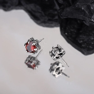 Handmade 925 sterling silver claw stud earrings with red cubic zirconia and punk gothic style
