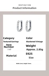 Detailed macro view of 925 sterling silver earrings with textured hammered finish