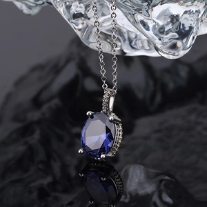 Deep blue oval sapphire crystal pendant necklace with sparkling micro-pave zirconia settings