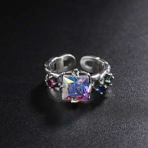 Macro shot of 925 silver vintage ring with rainbow crystals and gothic metal details