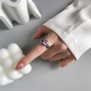 Macro detail of retro 925 silver ring with large square colorful iridescent gemstone