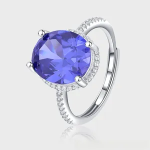 Macro view of S925 silver ring featuring a large oval purple sapphire and halo diamonds