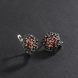 Vintage S925 sterling silver flower earrings with red garnet and black marcasite stones