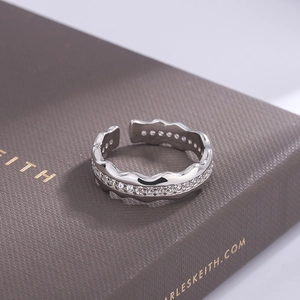 Elegant wavy S925 sterling silver open ring with pavé-set zircons on jewelry box