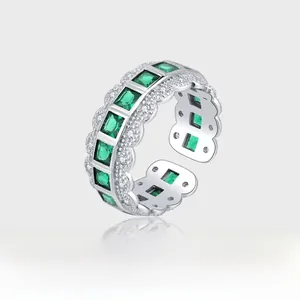 Detail of 925 sterling silver ring with square emerald green stone and lace pavé diamonds