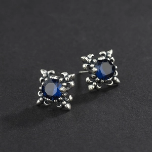 Vintage S925 silver stud earrings featuring blue gemstones and gothic cross flower motifs