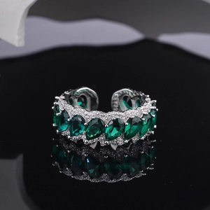 S925 sterling silver open ring featuring green pear-cut stones and pavé accents