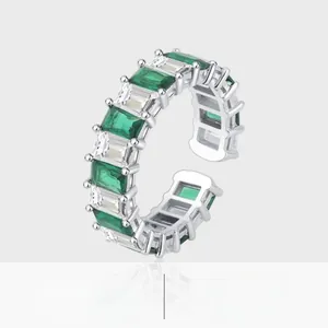 Detailed macro view of S925 silver ring featuring emerald green and white square zircons