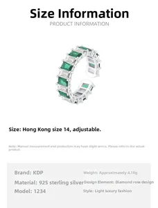 Detail of S925 silver ring featuring emerald cut green stones and white zircons