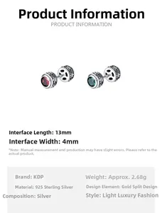 Détail de boucles d'oreilles 925 argent avec zircons rouges et verts et dimensions 13mm