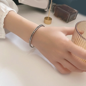 925 silver open cuff bracelet with colorful zircon stones worn by a model in a lifestyle setting