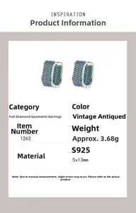 Detail view of S925 silver geometric hoop earrings with green and blue pavé zircon stones