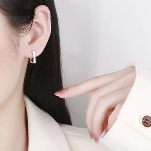 Elegant geometric S925 sterling silver rectangular hoop earrings worn by a model