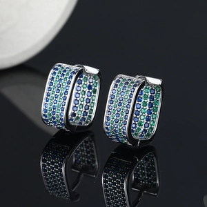 S925 silver hoop earrings with blue and green micro-pave zircons on black mirror background