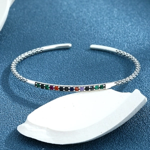 Vintage s925 silver open bangle featuring colorful stones and engraved scale textures
