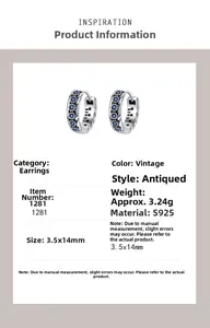 Macro detail of S925 sterling silver woven earrings with blue cubic zirconia stones