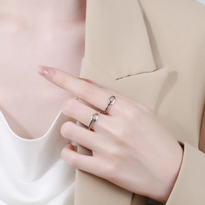 Irregular 925 sterling silver heart ring with black and blue stones on model hand