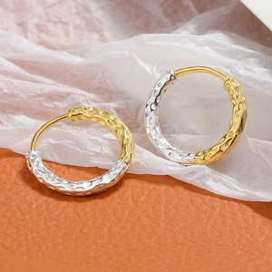 Modern two-tone S925 silver and gold hammered hoop earrings with textured finish