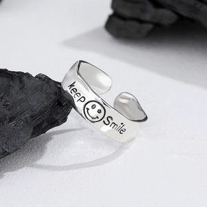 925 silver open ring with keep smile engraving and smiley face on black charcoal background