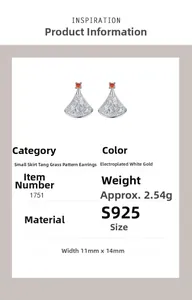 Macro view showing detailed S925 silver fan-shaped earring with red gemstone and engraving