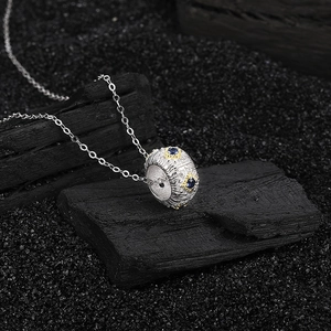 Vintage S925 silver necklace with textured two-tone pendant and blue diamond accents