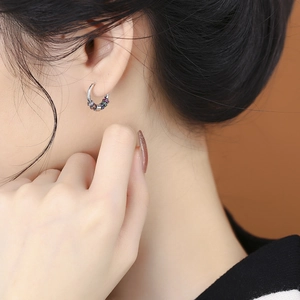 Polished S925 sterling silver hoop earrings with colorful rainbow beads on female model