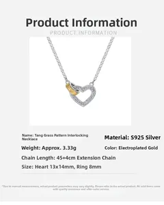 Macro detail of S925 silver heart necklace with engraved scrolls and two-tone finish