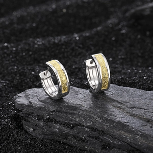 S925 silver hoop earrings with gold floral relief and vintage texture on dark stone
