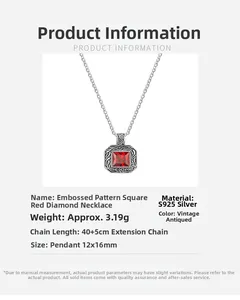Macro shot of S925 sterling silver vintage pendant with square red gemstone and carvings