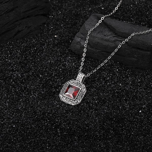 Vintage S925 silver necklace with rectangular ruby pendant on dark charcoal background