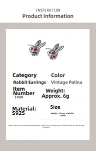 Detail view of S925 sterling silver vintage rabbit earring with red gemstone eyes