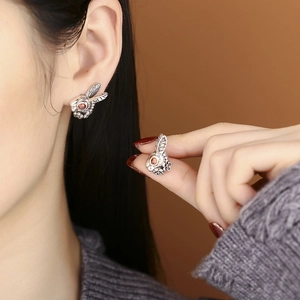 Vintage S925 silver rabbit stud earrings featuring red zircon eyes and floral neck details
