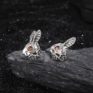 S925 silver rabbit stud earrings with red gemstone eyes and floral design details