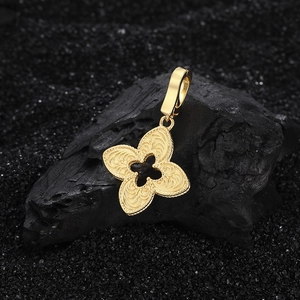 Golden S925 silver four-leaf clover pendant with intricate filigree on black stone