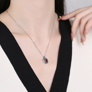 Vintage S925 sterling silver necklace featuring square ruby pendant with ornate carvings