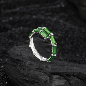 S925 sterling silver bamboo joint ring with green enamel on a black stone base