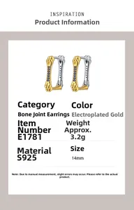 Macro detail of S925 silver joint-shaped earrings with blue zircons and gold plating