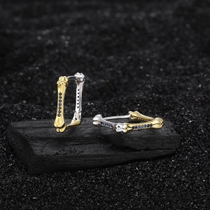 Elegant s925 silver bone earrings with blue crystals in gold and silver asymmetric design