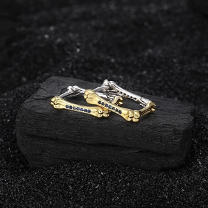 Unique S925 sterling silver bone-shaped huggie earrings with blue pavé stones