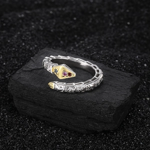 Snake open ring in silver and gold contrast with textured scales and colorful gemstones