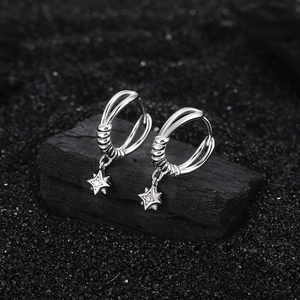 S925 sterling silver four-pointed star drop earrings on black textured stone base
