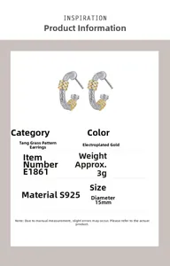 Detail view of S925 silver arabesque pattern earrings with gold plating and zircons