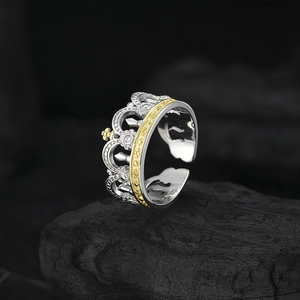 925 silver crown ring with gold plating and white zircon on black stone background