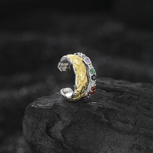 S925 silver ear cuff with gold leaf texture and colorful zircons on black stone base