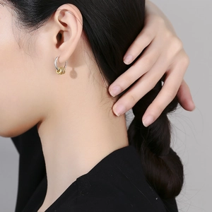 Minimalist S925 silver hoop earrings with three dangling gold rings and zircon stones