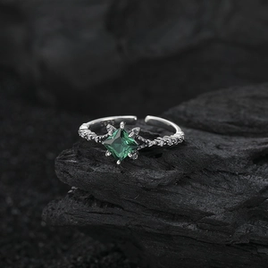 S925 sterling silver open ring with square green gemstone on a dark charcoal background