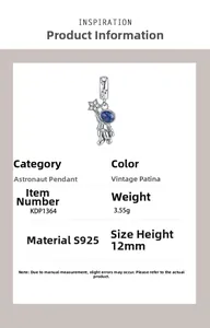 Macro shot of 925 sterling silver astronaut pendant with blue helmet and star details